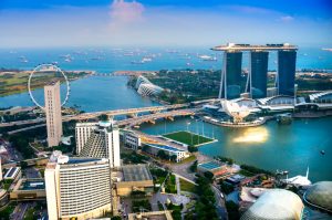 Fish-eye view of Singapore city skyline at sunset.